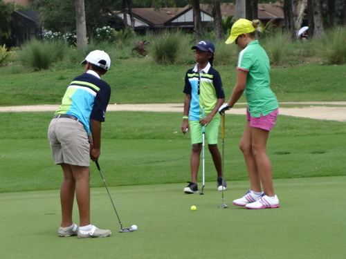 a-boy-and-a-girl-playing-golf