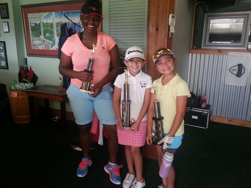a-woman-and-two-girls-with-trophy