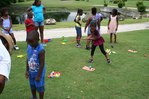 child-practicing-at-golf-ground-16