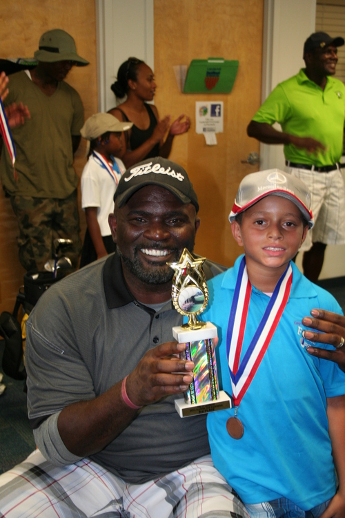 child-practicing-at-golf-ground-33