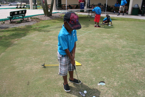 child-practicing-golf-16