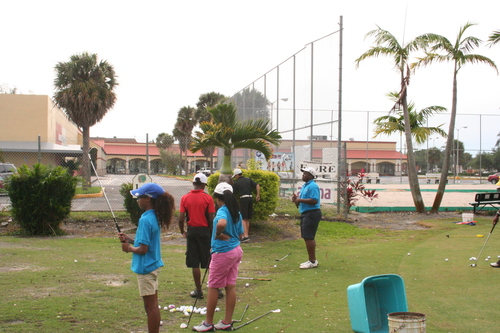 child-practicing-golf-3