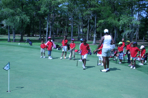 child-practicing-golf-34