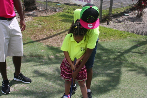 child-practise-golf-in-ground-12