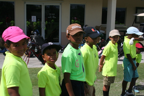 child-practise-golf-in-ground-16