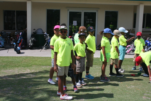 child-practise-golf-in-ground-3