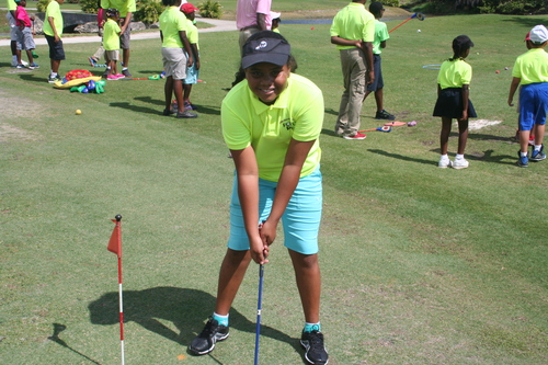 child-practise-golf-in-ground-4