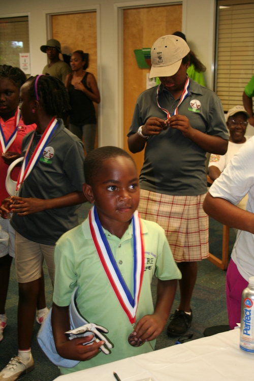 child-receive-medal