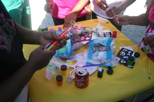 child-using-painting-brushes