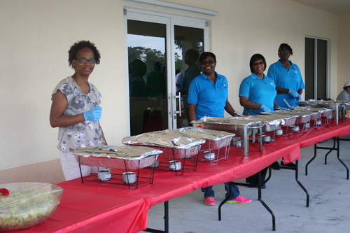 four-woman-distiputing-food