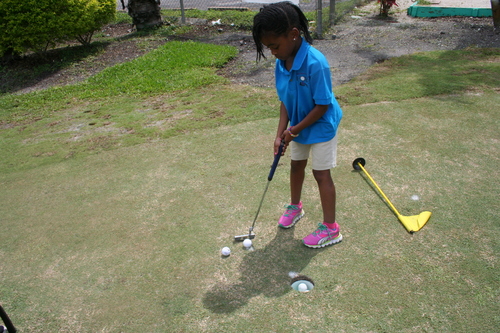 girl-trying-golf