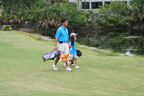 golf-man-walking-with-a-child