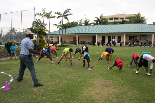 golf-teacher-couching-to-child-6