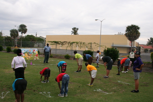 golf-teacher-couching-to-child-7