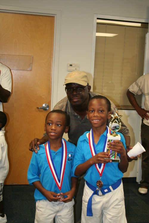 two-boys-receive-trophy