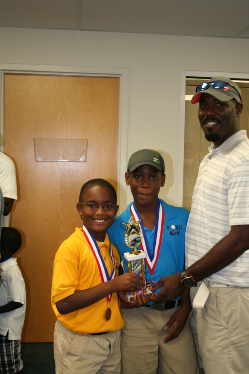 two-boys-with-trophies