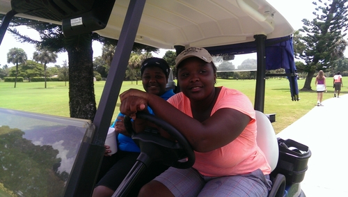 two-girls-in-golf-cart