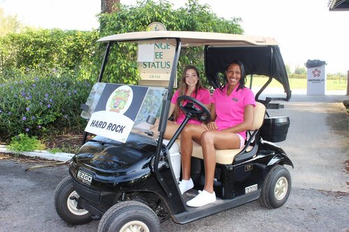 two-women-at-golf-cart