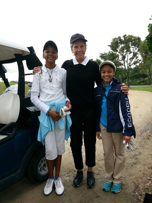 woman-playing-golf-with-child