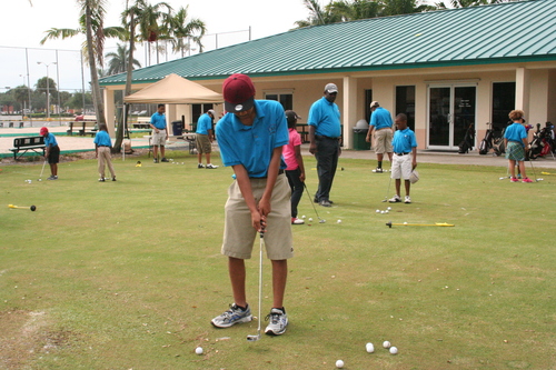 young-boy-playing-golf